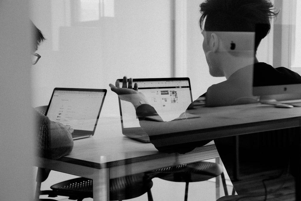 Two colleagues reviewing something urgent together