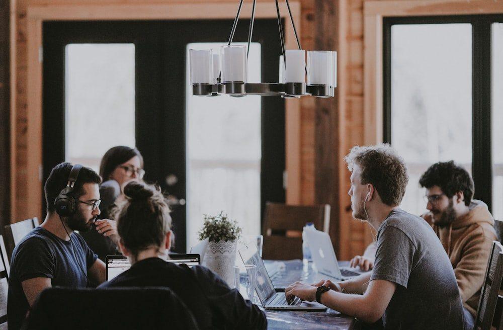 A small team reviewing a migration plan together around a table
